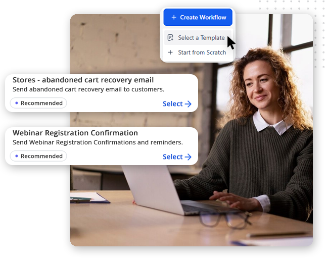 A woman sits at a desk with a laptop, smiling. On the image are digital pop-ups showing options in CRM software for small businesses, like creating workflows for abandoned cart emails or webinar registration confirmations.