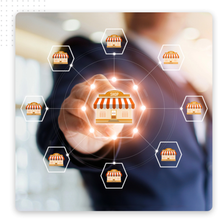 Xtreme-Automator-Franchise-Img A person in a business suit touches a virtual shop icon, surrounded by interconnected shops, representing a network or franchise concept—ideal for showcasing the reach of an automation company or the power of the best CRM software.