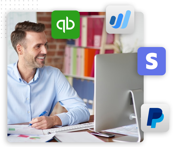 A smiling man sits at a desk working on a computer, surrounded by logos of QuickBooks, Wave, Stripe, and PayPal, suggesting he is managing finances for an automation company or integrating a CRM platform with these payment solutions.