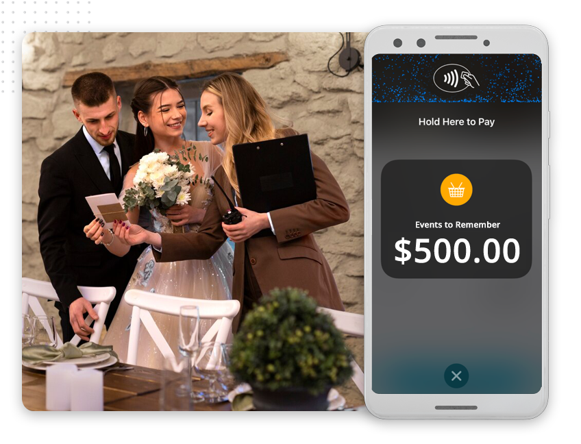 A bride and groom make a mobile payment to an event planner using a card and smartphone, with the screen displaying “Events to Remember $500.00,” showcasing seamless transactions like those offered by leading web design company services.